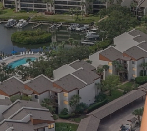 Siesta Key coastal condos, marina and pool aerial